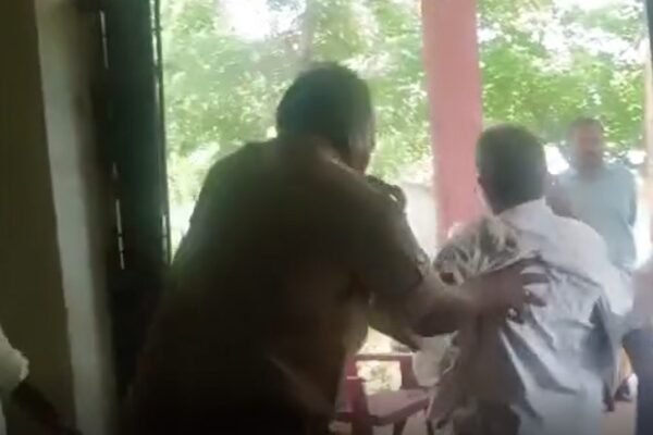 Elderly farmer representing a grievance, necked out by heartless cop